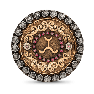 A custom belt buckle for women featuring a golden bronze ranch brand on a circle-shaped german silver base with roses and bronze scrolls 